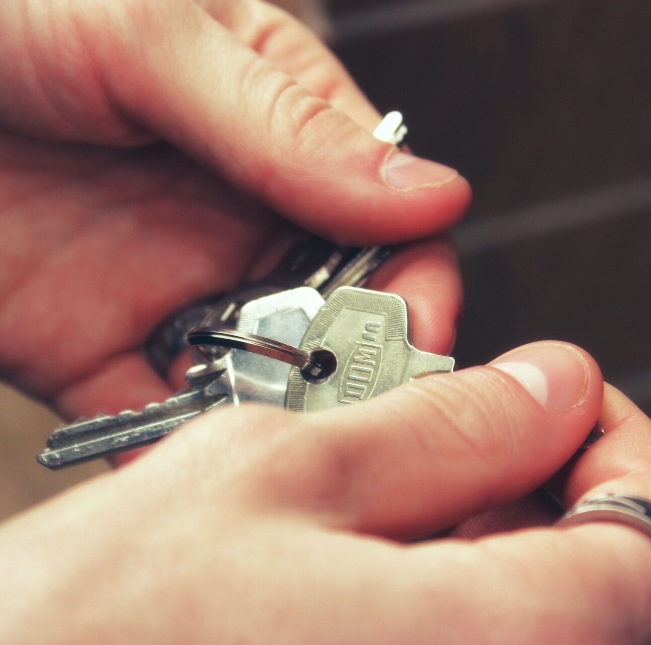 A person holding keys