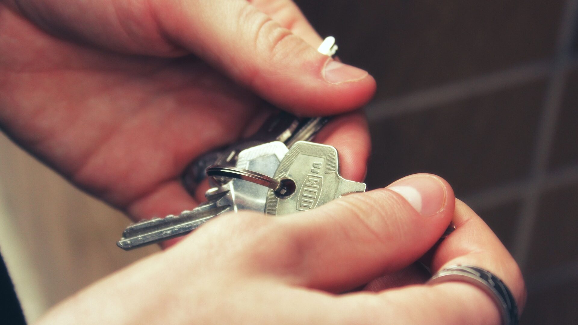 A person holding keys